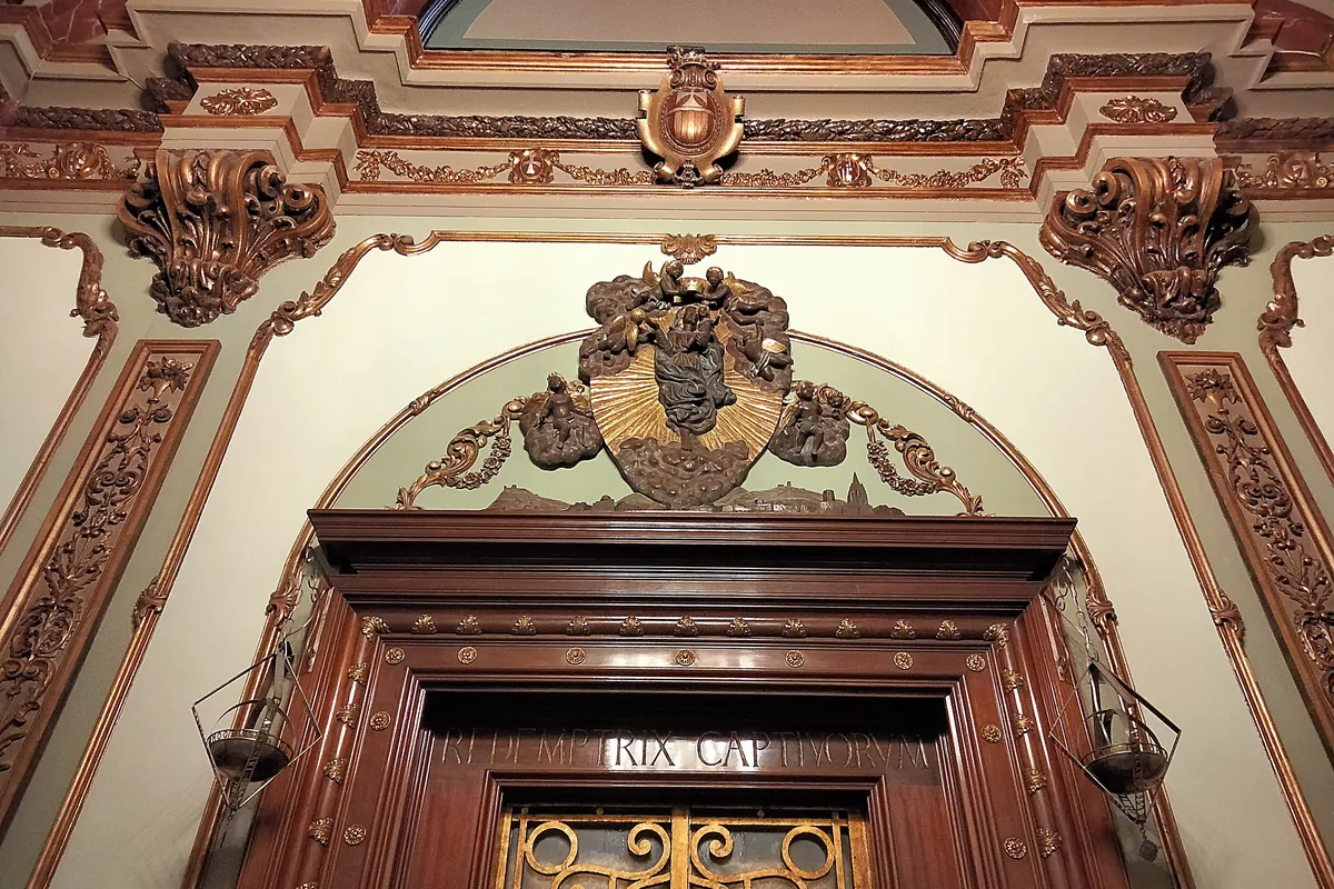 Carved and gilded decoration around a doorway inside the basilica.